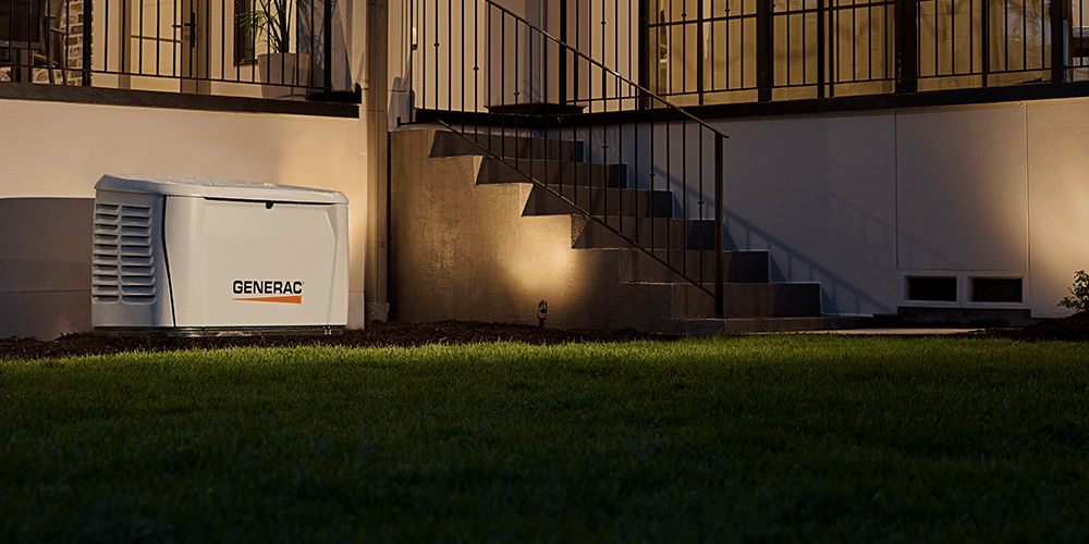 Generac home generator next to a home with the lights on