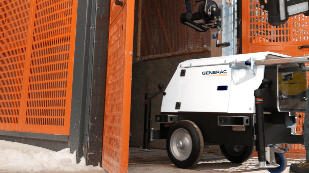  Image of a portable Generac industrial generator being taken out of storage