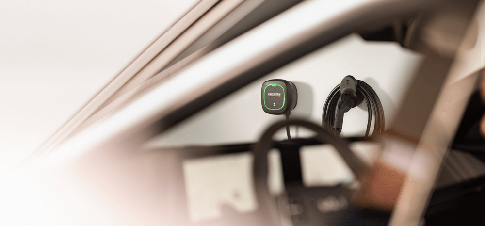 Generac EV Charger shown installed in the background of a garage