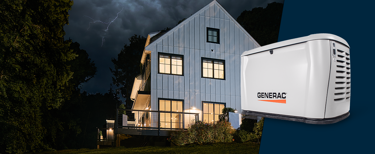 Generac home standby generator layered on top of a home with the lights on in the dark