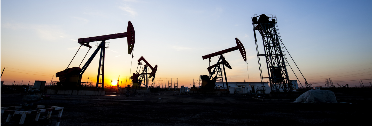 Oil field pumpjacks at sunset representing how Generac mobile gaseous generators power operations using wellhead gas for reliable, cost-effective energy