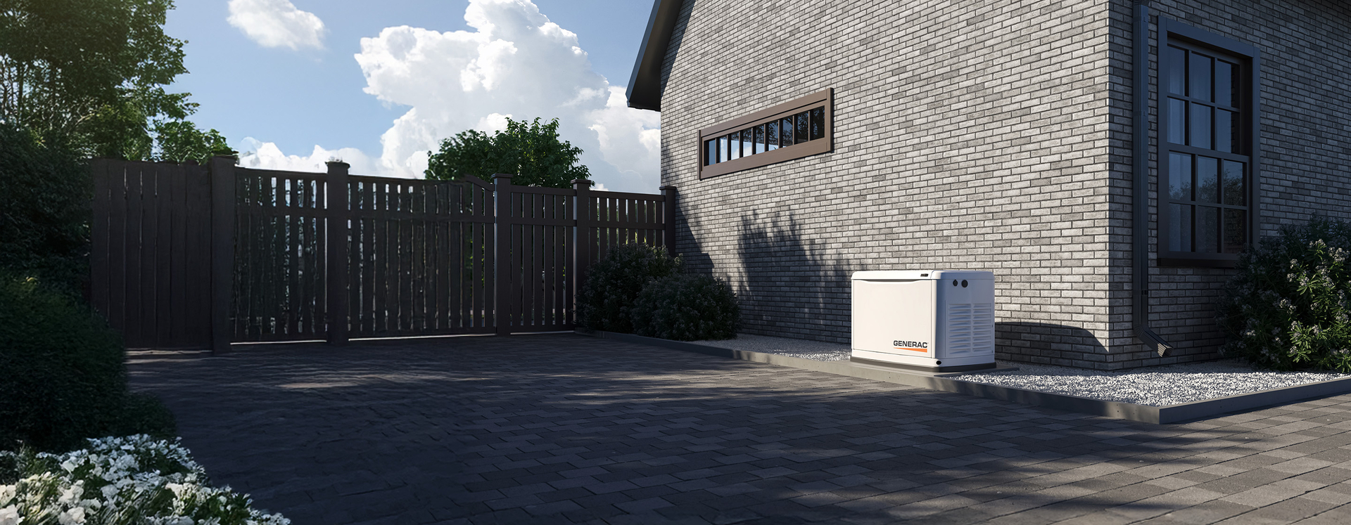 Generac home standby unit outside a brick home in summer