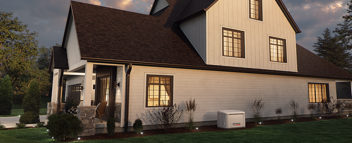 Home standby generator next to a suburban home with the lights on at dusk