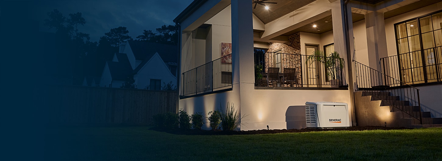 generac home generator installed next to a porch in the evening