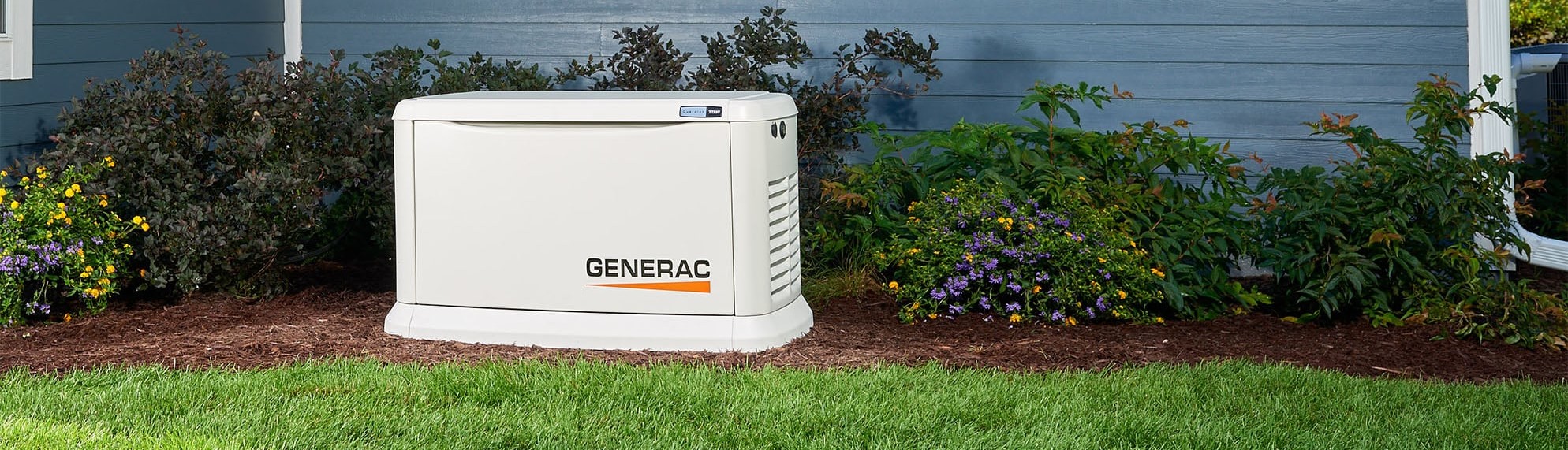 Generac Home Standby Generator in a garden outside a home.