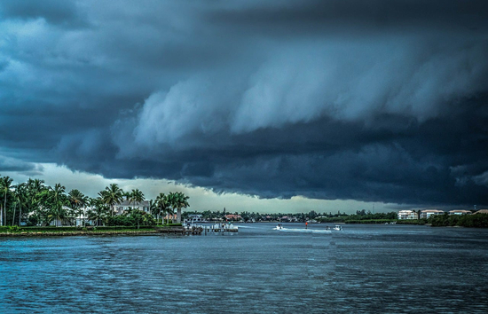 Introduction  The unpredictable nature of hurricanes and their potential to cause widespread power outages highlight the critical need for businesses to implement robust emergency preparedness strategies. Generac Industrial Energy offers this guidance for businesses to navigate hurricane season, with a particular focus on maintaining power, ensuring personnel safety, and leveraging available resources for comprehensive disaster planning.  In recent years, hurricanes and tropical storms have been responsible for some of the most severe and prolonged power outages, often lasting for several days or even weeks. The past few hurricane seasons saw significant impacts on the electric grid, underscoring the ongoing threat these storms pose to business continuity. When the power goes out, operations become significantly more challenging. Backup generators provide a crucial layer of safety and security, offering peace of mind when the power grid is unavailable.  Hurricane Season: Lessons Learned  The last few hurricane seasons served as a stark reminder of the vulnerability of businesses to severe weather events. Hurricane Beryl, for instance, caused extensive power disruptions across the Caribbean and parts of the Southeastern U.S., leading to prolonged business closures. Similarly, Hurricanes Debby, Francine, and Helene resulted in significant power outages, supply chain disruptions, and challenges for employees attempting to reach their workplaces. These events reinforce the necessity of proactive planning that extends beyond just physical infrastructure to encompass personnel safety and logistical considerations.  Planning for an Emergency Power System:  Assess Needs: Determine the critical systems and equipment that require continuous power. This will dictate the size and type of generator needed. Location and Installation: Consider optimal placement for the generator, ensuring proper ventilation and compliance with local codes. Remember the generator will also require protection from physical hazards such as flooding and wind. Generac Industrial Energy offers generator enclosures that meet stringent High Velocity Hurricane Zone (HVHZ for parts of FL) ballistic impact requirements. Fuel Supply: Determine the most appropriate fuel source for your location and operational needs, whether it’s on-site storage for diesel generators or a natural gas connection. Where it is available, natural gas has consistently demonstrated consistently high availability following hurricane events with few if any outages even in areas affected by flooding. Operating and Maintaining Your Emergency Power System  Regular Maintenance: Conduct manufacturer’s recommended routine maintenance on your backup generator, including oil changes, filter replacements, and battery checks. Regular Automatic Exercises: Periodically test your generator under load to ensure it functions correctly when needed. This helps identify potential issues such as overloading, or equipment problems before an emergency strikes. Problems such as a fouled radiator will not be apparent during unloaded exercises since there is very little load on the engine. Fuel Management: For diesel generators, implement a fuel testing, rotation and treatment plan to prevent fuel degradation and ensure readiness. Regular loaded exercises are a simple method to improve fuel turnover. Safety Protocols: Familiarize staff with safe operating procedures for the generator, including lockout/tagout procedures during maintenance. While most standby power systems operate fully automatically, knowing how to operate the system manually, or being able to identify abnormal operations will be helpful during an extended outage. Operational Checks (if practical): Basic operational checks conducted bi-weekly by on-site personnel are an efficient method to identify and correct minor issues such as a low fuel condition, an open circuit breaker, closed fuel valve, or the generator key switch being accidentally left in the “off” position. Most generator “failures” are in fact caused by human error that could have been easily corrected had they been detected prior to a power outage. Fuel Supply Plans for Diesel Generators  Strategic Sourcing: Identify a reliable fuel supplier and establish priority delivery agreements. If practical, identify at least one additional fuel supplier located 50-100 miles away. This reduces the probability the fuel supplier’s operations will be impacted by the same widespread event.  On-site Fuel Storage: Check diesel fuel levels as part of regular operational checks, don’t wait for the low fuel alarm to sound on the remote annunciator! Fuel Quality: Implement a fuel testing and treatment program to prevent contamination and ensure fuel quality, especially for long-term storage. Comprehensive Emergency Preparedness Resources  Various governmental and educational organizations offer invaluable guidance for businesses preparing for hurricanes and other disasters. These resources provide frameworks for developing robust emergency plans, understanding risks, and  accessing assistance.  Federal Emergency Management Agency (FEMA): FEMA provides extensive resources for business preparedness, including tools for identifying risks, developing continuity plans, and applying for disaster assistance. They emphasize that 80% of a building's value lies in its equipment, inventory, and contents, and businesses should anticipate significant damage to these assets. State and Local Emergency Management Agencies: These agencies offer localized information, alerts, and specific guidance tailored to regional threats and resources. Ready.gov: This national public service campaign, managed by FEMA, provides practical tips and resources for individuals, families, and businesses to prepare for emergencies. Business Continuity  While protecting property and ensuring operational uptime are crucial, the success of a business post-hurricane relies on the well-being and availability of its personnel.  Employee Communication Plan: Establish clear and reliable communication channels to reach employees before, during, and after a storm. This includes emergency contact lists, designated check-in procedures, and methods for  disseminating critical updates. Family Preparedness: Encourage employees to develop personal and family emergency plans. Provide resources and information on how they can secure their homes, prepare emergency kits, and plan for potential evacuations. A  business cannot function if its employees are unable to leave their homes or are dealing with personal crises. Flexibility and Support: Be prepared to offer flexibility in work arrangements post-storm, recognizing that employees may face challenges with childcare, housing, or transportation. Consider providing resources or assistance programs to aid in their personal recovery as part of a comprehensive business continuity plan. This may include setting aside space at the place of business for employees’ families; the workplace may be the only safe location with power for days to weeks. Conclusion  Effective hurricane preparedness is an ongoing process that demands continuous review and improvement. By proactively addressing emergency power needs, leveraging available preparedness resources, and crucially, prioritizing the safety and well-being of personnel, businesses can significantly mitigate the impact of hurricanes. Making the choice to prepare today not only protects physical assets but also safeguards the personnel essential for your company’s resilience and long-term success. About the Author  Michael Hainzl, CBCP, brings over two decades of engineering and field operations experience in the telecommunications industry prior to joining Generac Industrial Energy in 2015. With an extensive background in business continuity planning and disaster recovery operations spanning from Hurricane Katrina (2005) to Sandy (2012), Michael is dedicated to ensuring resilient design and operation of critical power systems.
