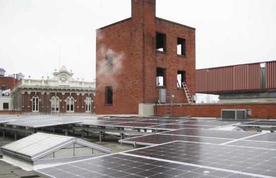 Image of the roof of the Portand First Firestation, featuring an expansive array of solar panels that produce energy for their microgrid system