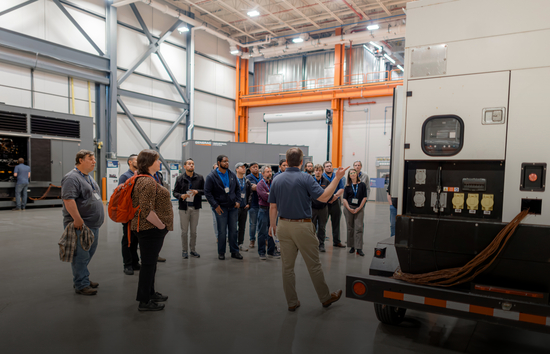 Attendees tour Generac’s world-class manufacturing facility during the Engineering Symposium, a biannual event offering CEU/PDH courses on power systems, generator sizing, paralleling, and code compliance.