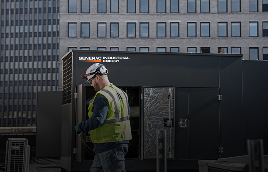 Generac Industrial Energy technician servicing a rooftop generator representing Generac’s expert partner network of industrial generator dealers.