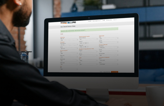 Engineer using Generac’s Power Design Pro tool on a desktop computer to size an industrial generator system