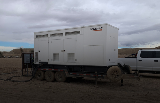 Mobile generator in rugged oil and gas field representing Generac's warranty info coverage and service support for long-term performance in demanding conditions.