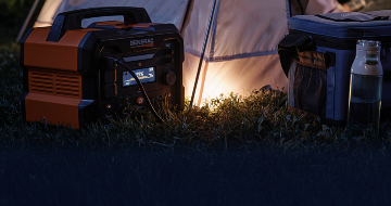 A portable power station being used at a campsite
