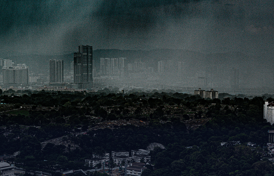 Overcast city skyline under stormy skies, depicting the aftermath of a hurricane