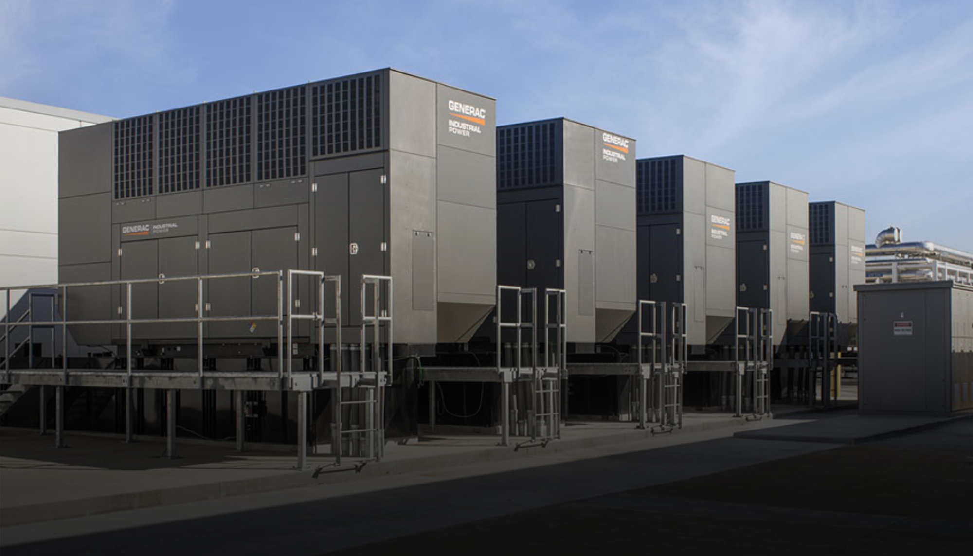 Row of Generac Industrial Power generators representing Bi-Fuel, Diesel, and Gaseous models available as BIM files for Revit-based industrial design projects