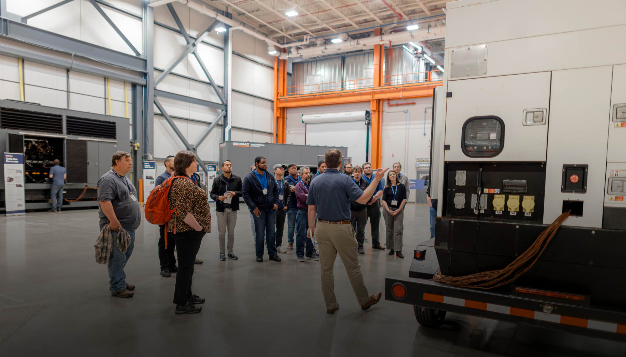 Attendees tour Generac’s world-class manufacturing facility during the Engineering Symposium, a biannual event offering CEU/PDH courses on power systems, generator sizing, paralleling, and code compliance.