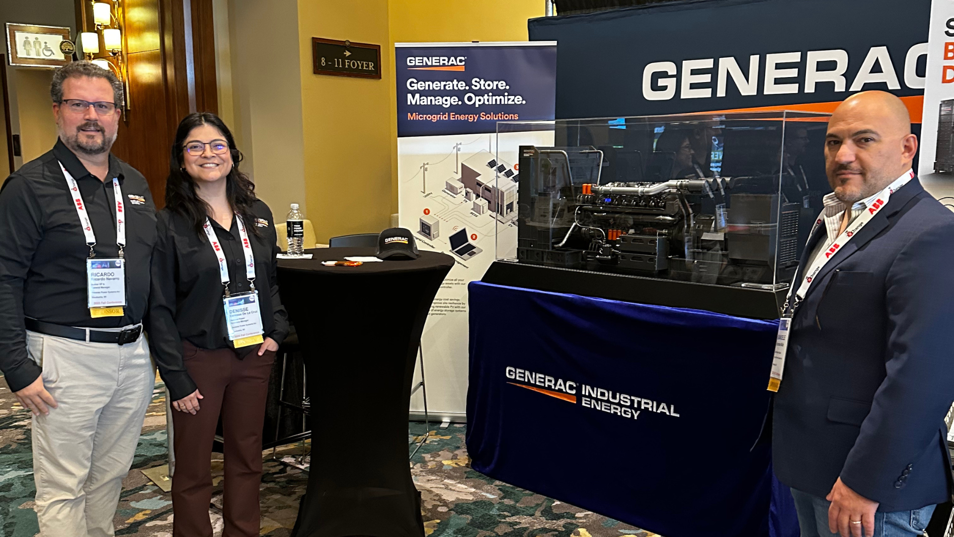 Generac Industrial Energy data center sales people smiling and gathered in their 7x24 Exchange International booth