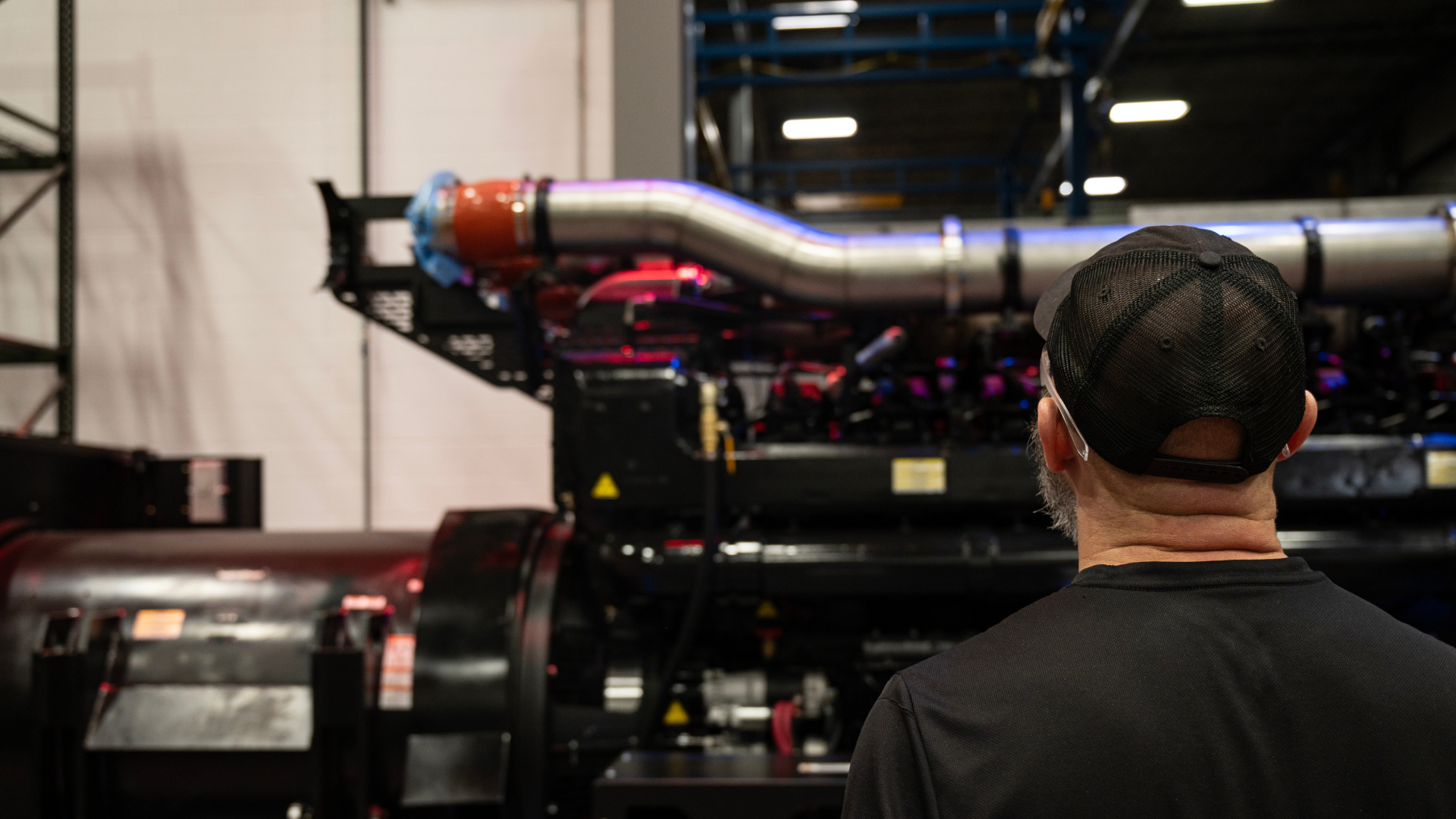 Generac Industrial Energy employee looking at a large mega watt data center generator