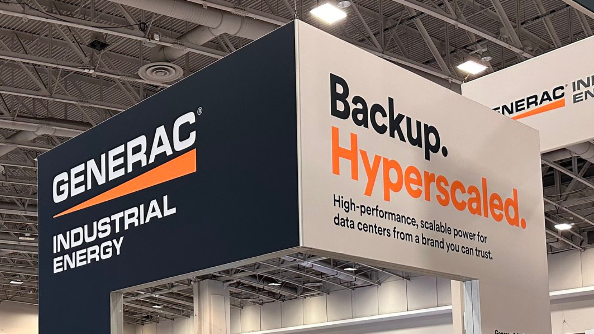 Generac Industrial Energy "Backup. Hyperscaled." sign a data center trade show