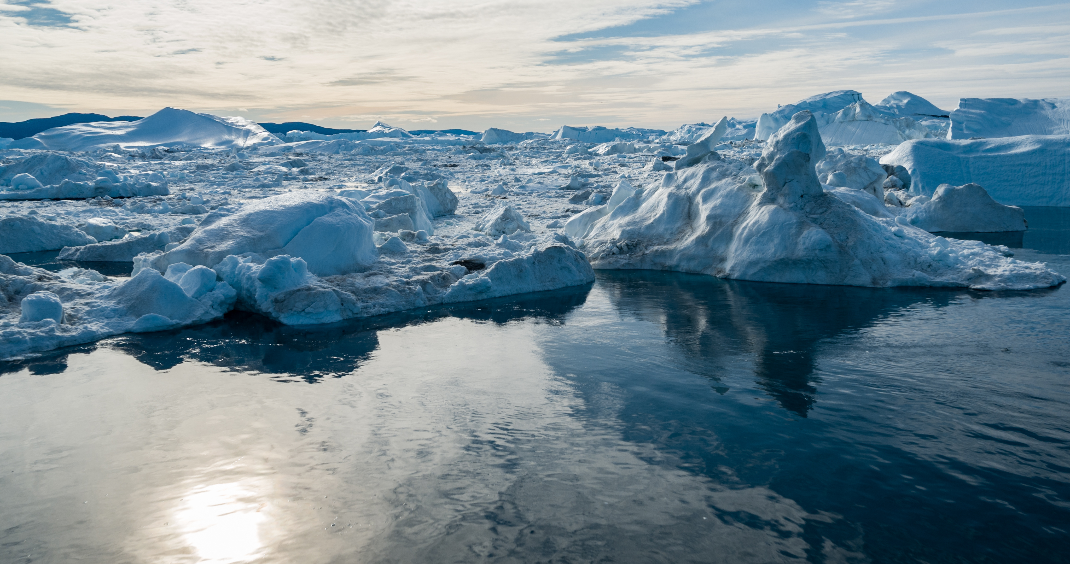 Polar ice caps melting into sea as a result of climate change