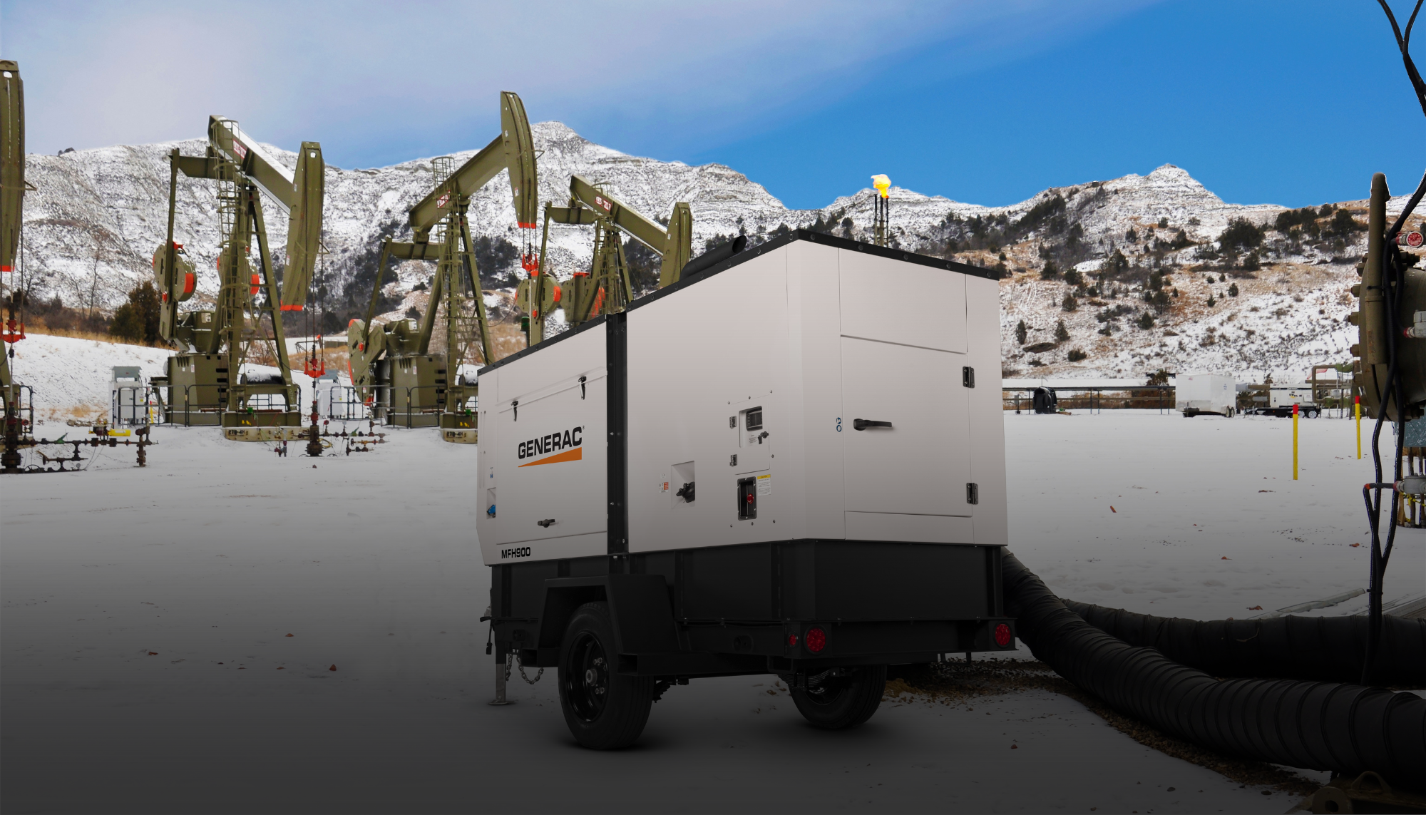 Generac mobile heater unit operating at a remote oilfield in winter. Access Generac heater and mobile pump manuals for reliable setup like this, as well as for service, and maintenance support