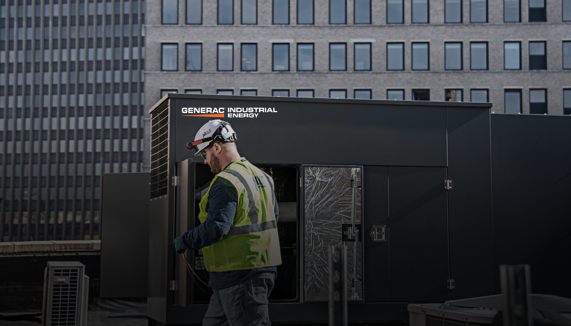 Generac Industrial Energy technician servicing a rooftop generator representing Generac’s expert partner network of industrial generator dealers.