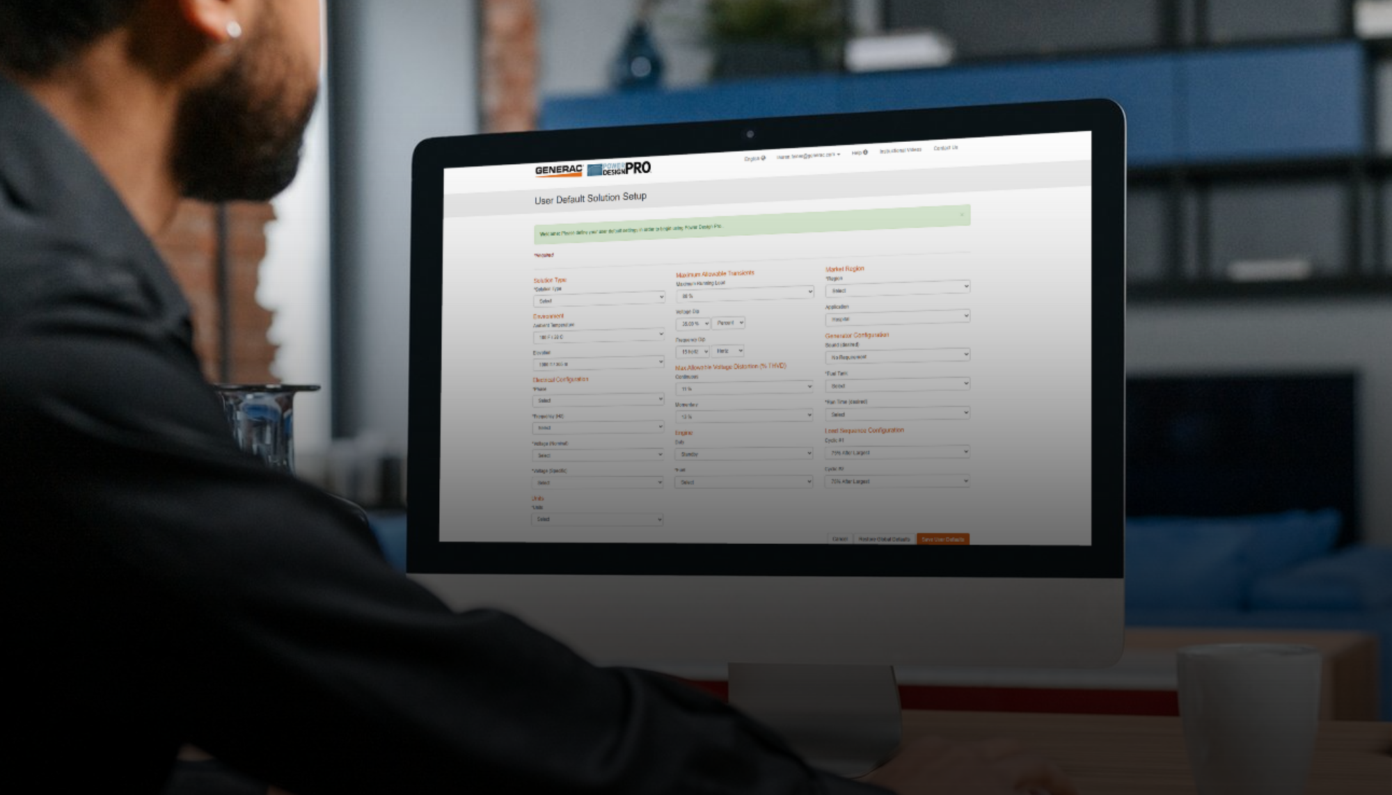 Engineer using Generac’s Power Design Pro tool on a desktop computer to size an industrial generator system