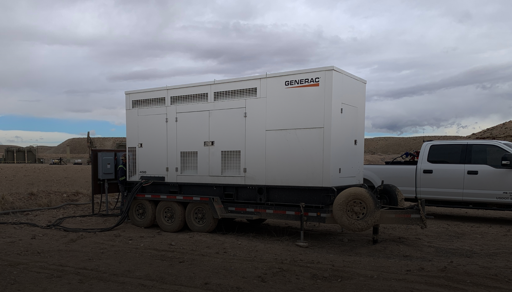Mobile generator in rugged oil and gas field representing Generac's warranty info coverage and service support for long-term performance in demanding conditions.