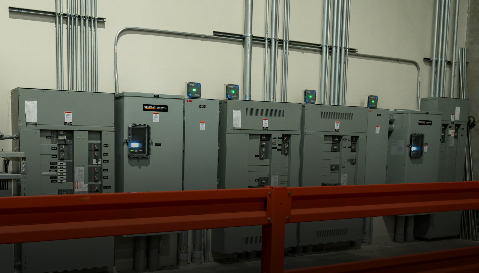Industrial transfer switches in a facility using a Generac Industrial Energy generator representing insights from white papers on transfer switches, backup power systems, generator maintenance, and other in-depth considerations.