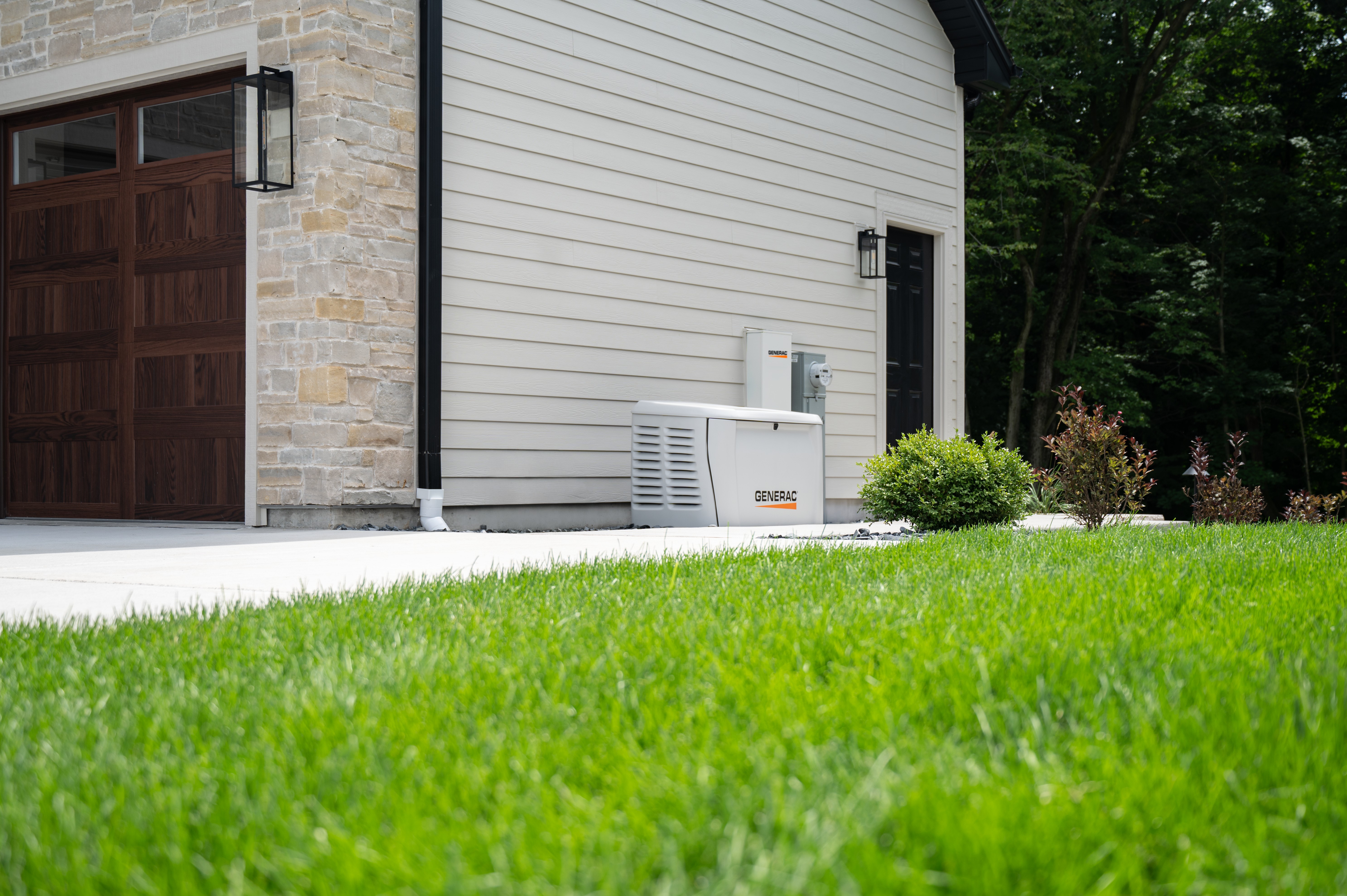  Generac home standby generator and PWRcell battery storage system are connected outside a home