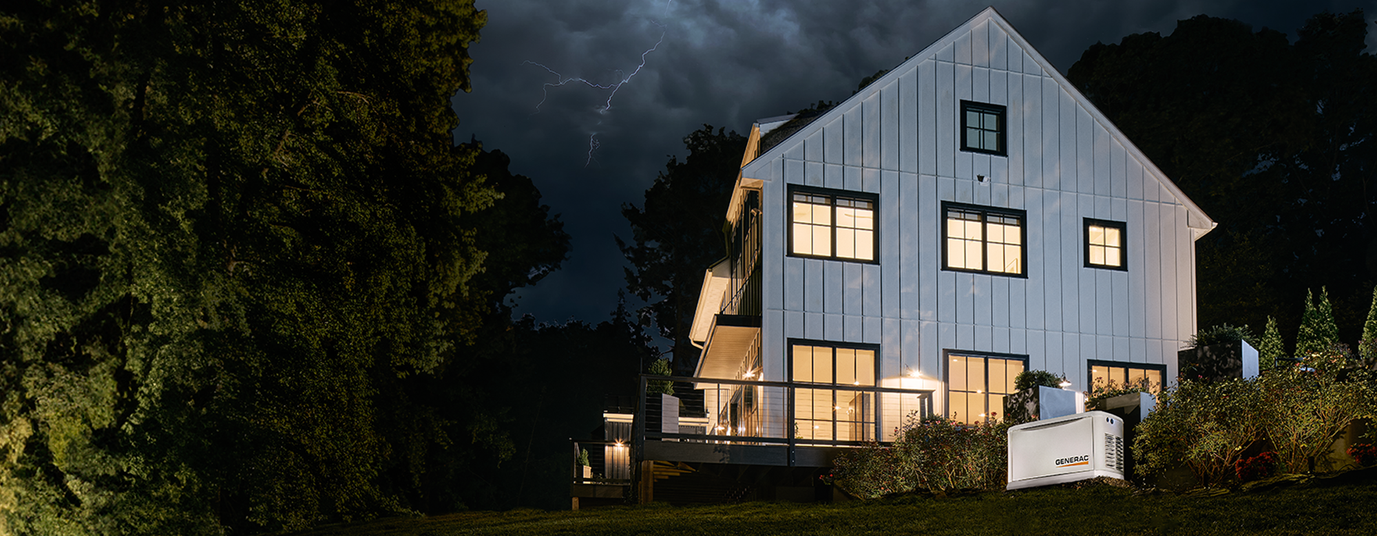 Generac homestandby generator powering a home during a storm with dark clouds