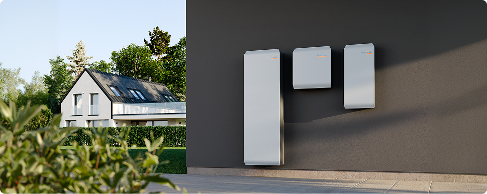 Split image showing a modern home exterior on the left and a Generac PWRcell 2 home battery storage unit on the right.