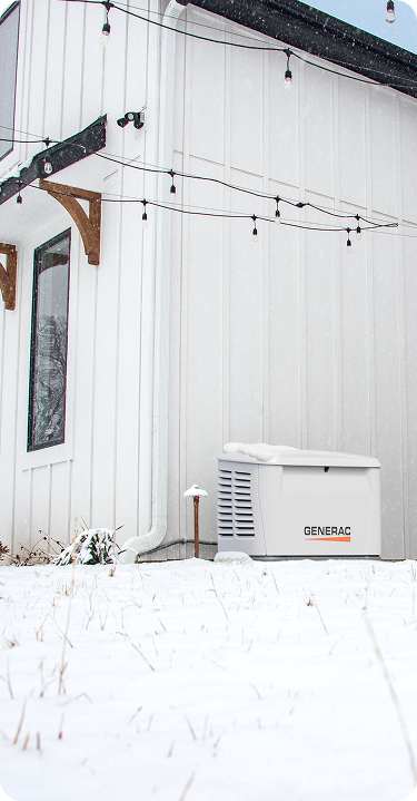Generac standby generator in a snowy yard
