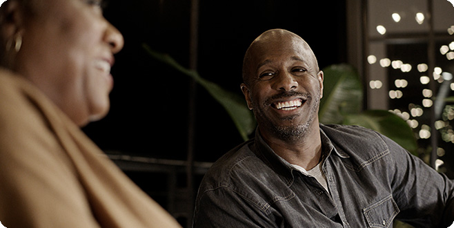 man smiling at woman