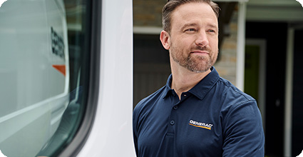 Generac installer grinning outside
