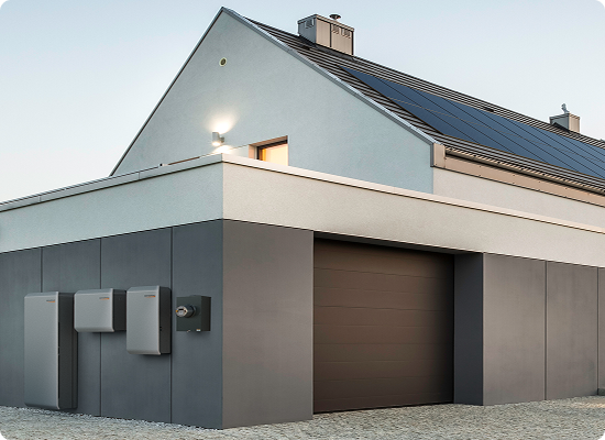 PWRcell2 installed outside a home paired with solar panels