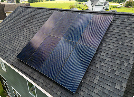 black solar panels on top of a roof