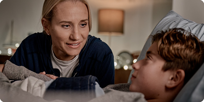 woman taking care of unwell child